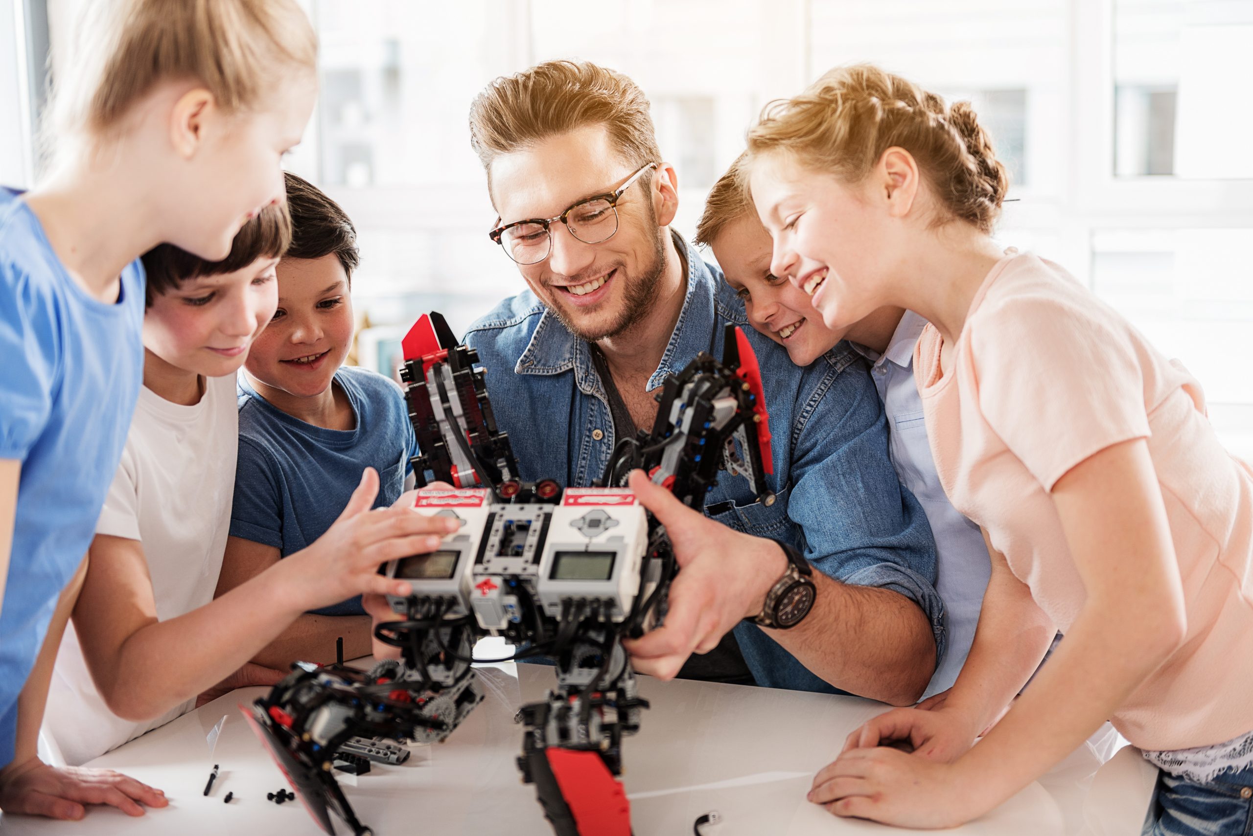 Happy smiling technical team testing quadcopter